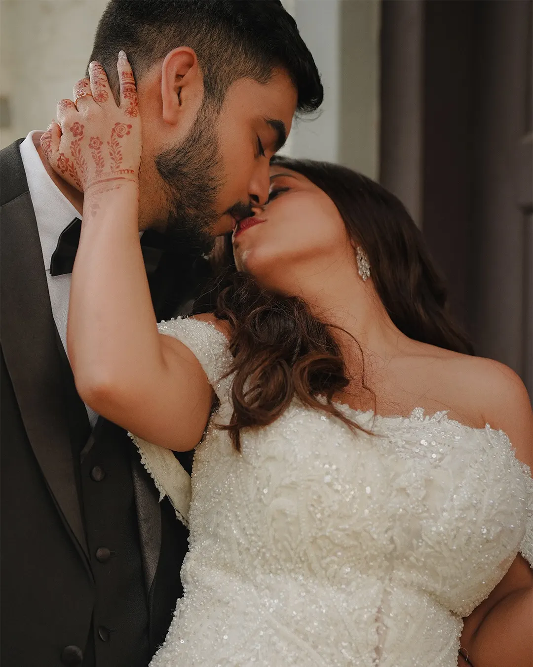Newlyweds sharing a kiss after their ceremony