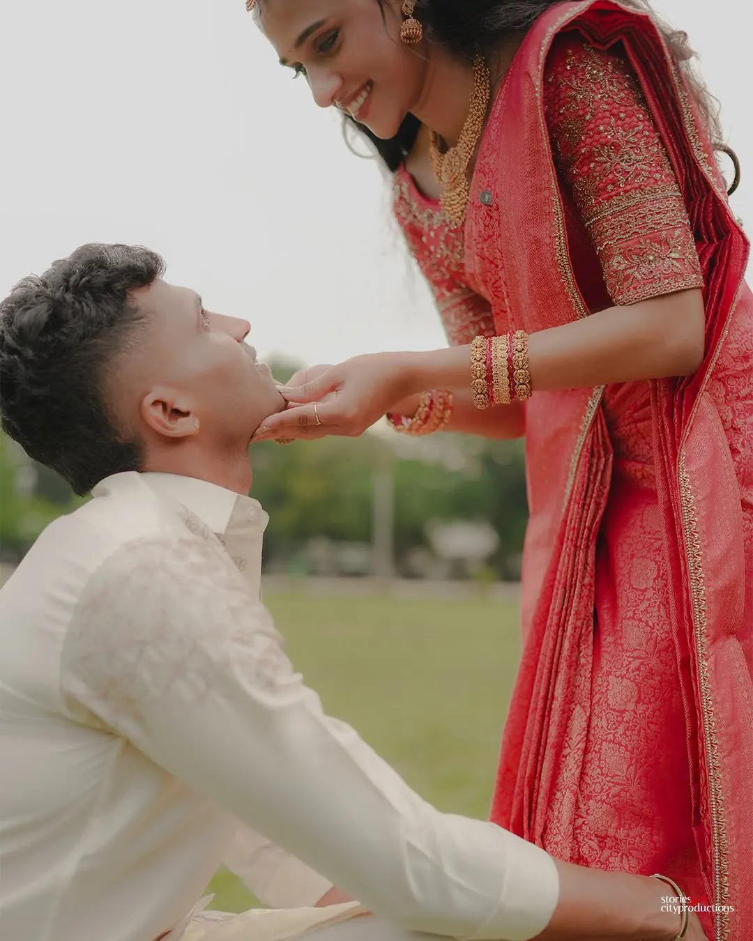 Newlyweds laughing together during their Kerala wedding